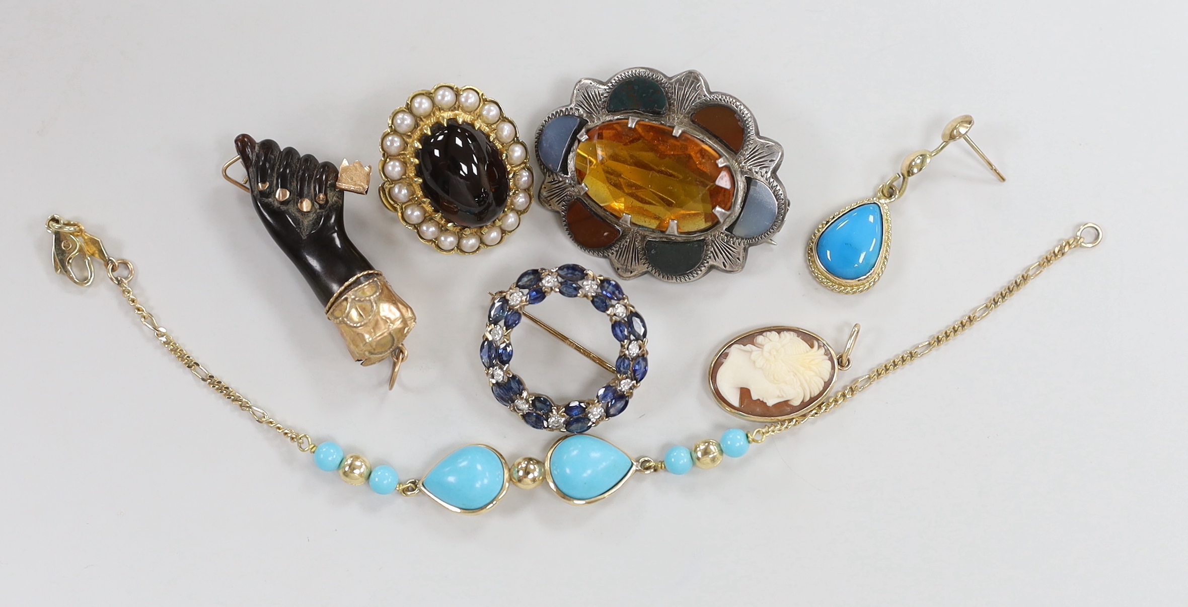 A 585 yellow metal and simulated turquoise set bracelet, A Victorian yellow metal mounted clasped hand with key charm and five other items including Scottish hardstone brooch and a 375 and gem set brooch.